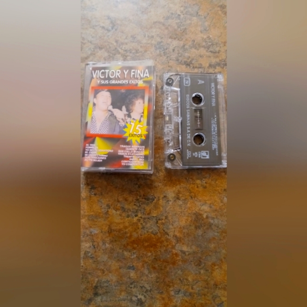 Victor y Fina 15 Exitos Cassette Tape — Brown Cassette with Clear Case